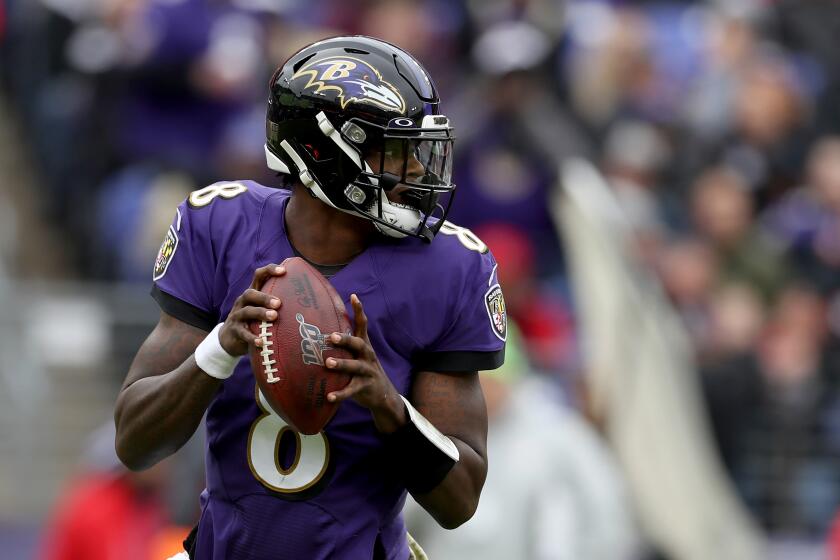 Ravens quarterback Lamar Jackson looks to pass during a game against the Texans on Nov. 17 at M&T Bank Stadium. 