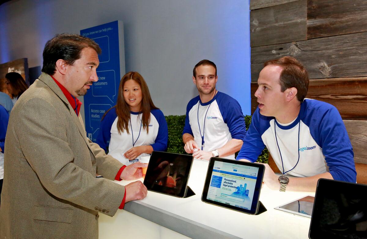 A small business owner gets advice at a LegalZoom booth in 2014 in New York.