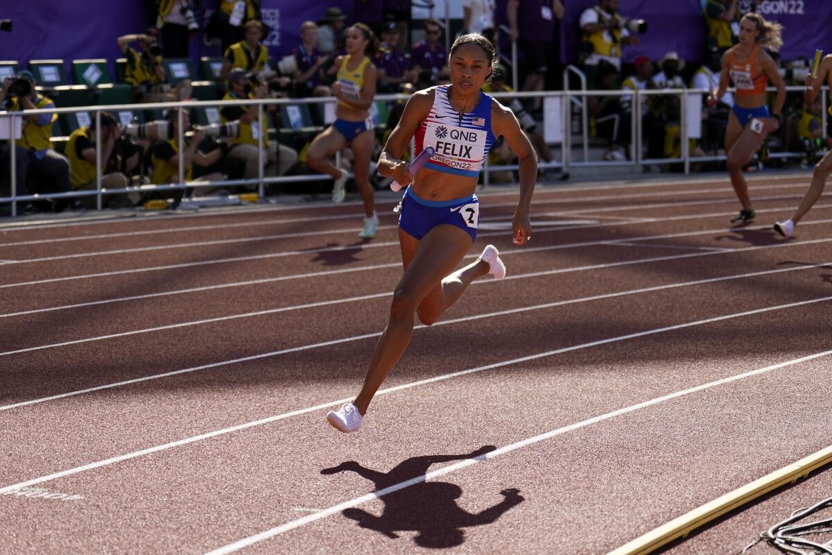 Allyson Felix runs in the women's 4x400-meter relay at the world track and field championships on July 23.