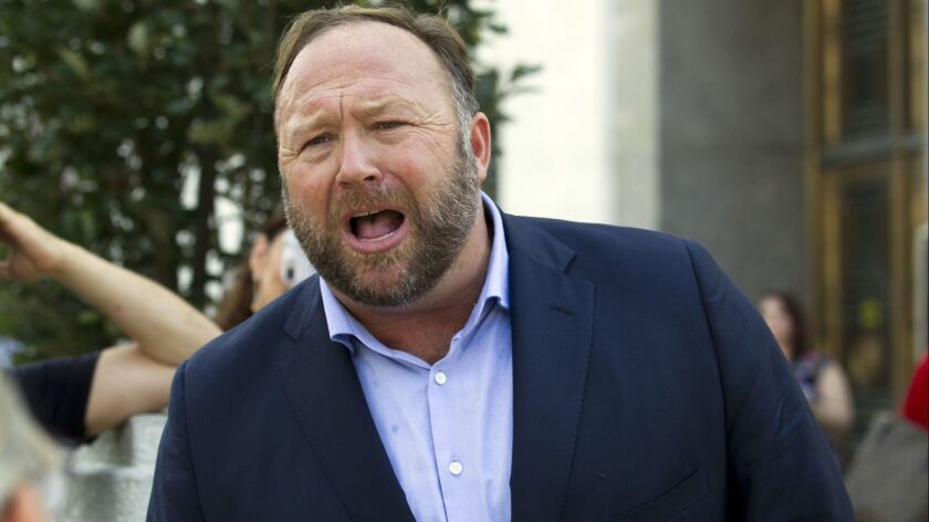 Alex Jones speaks on Capitol Hill on Sept. 5 after listening to Twitter CEO Jack Dorsey testify before the Senate Intelligence Committee. Twitter banned Jones over abusive behavior.