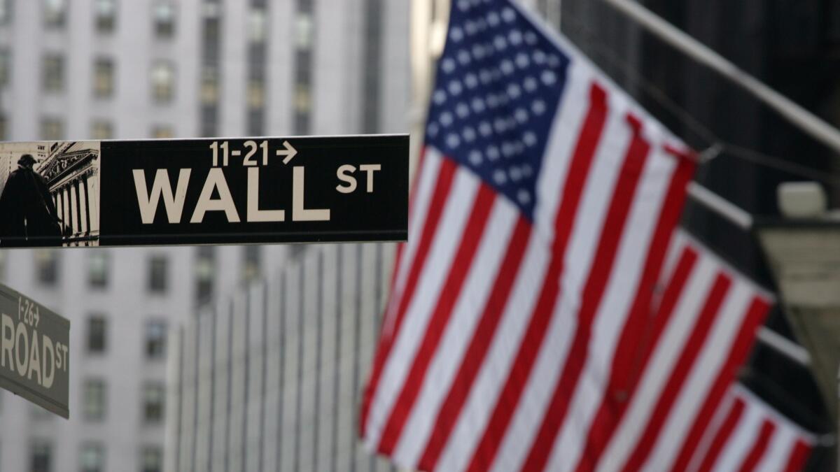 A Wall Street sign hangs in New York.