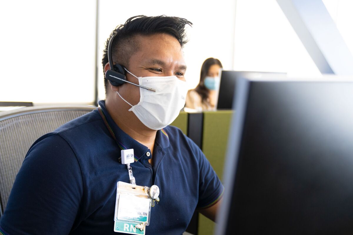 Joe Bautista, a nurse with UCSD Health, checks on coronavirus patients daily by telephone.