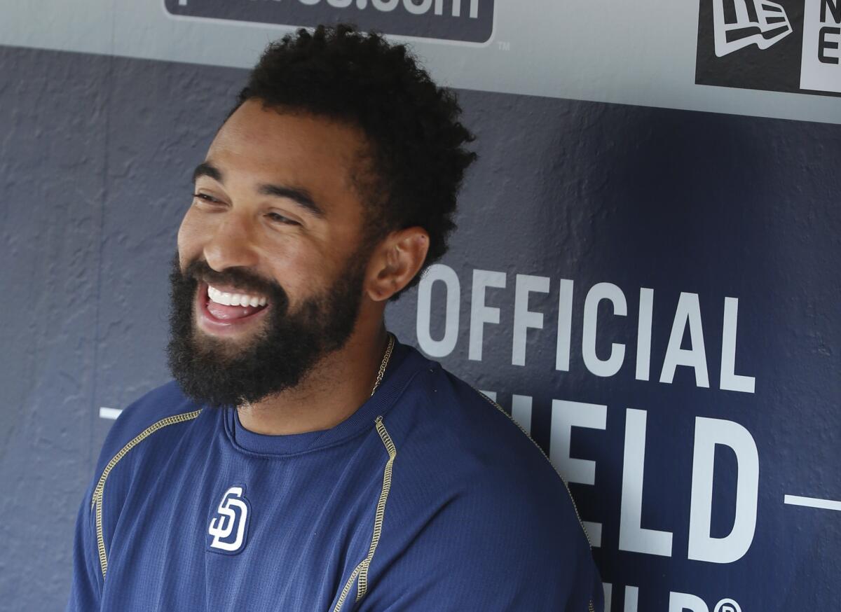 San Diego's Matt Kemp sings along with a Lionel Richie's song prior to a baseball game against the Dodgers on April 24.