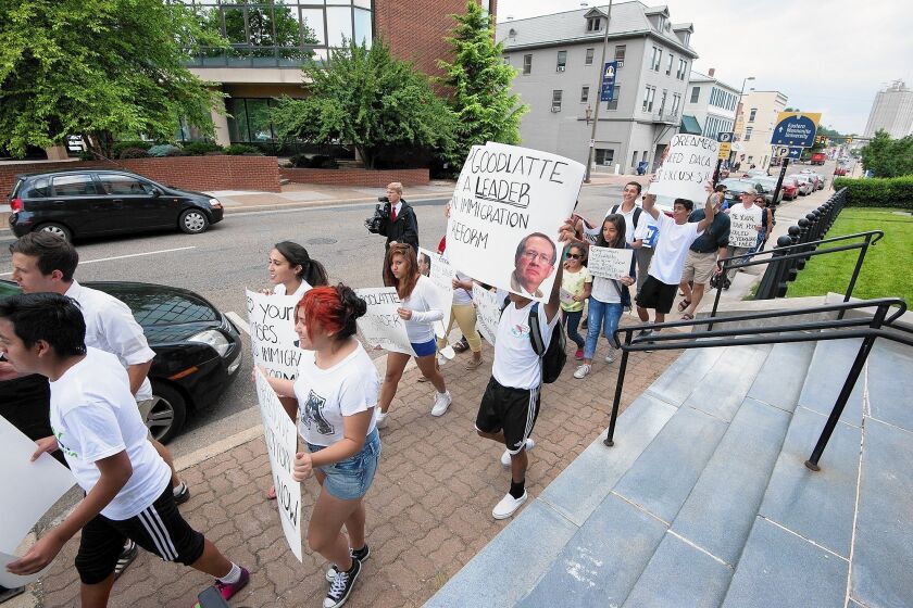 Demonstrators march in support of immigration reform in Harrisonburg, Va. Sponsors in the state have accepted 2,234 unaccompanied children caught crossing the U.S. border illegally.