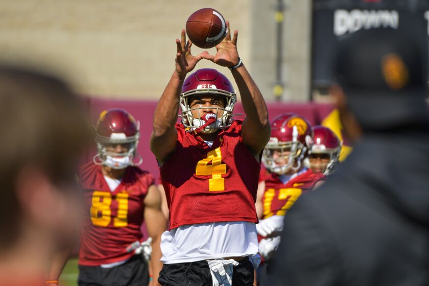 USC wide receiver Bru McCoy catches a pass during a team practice session.