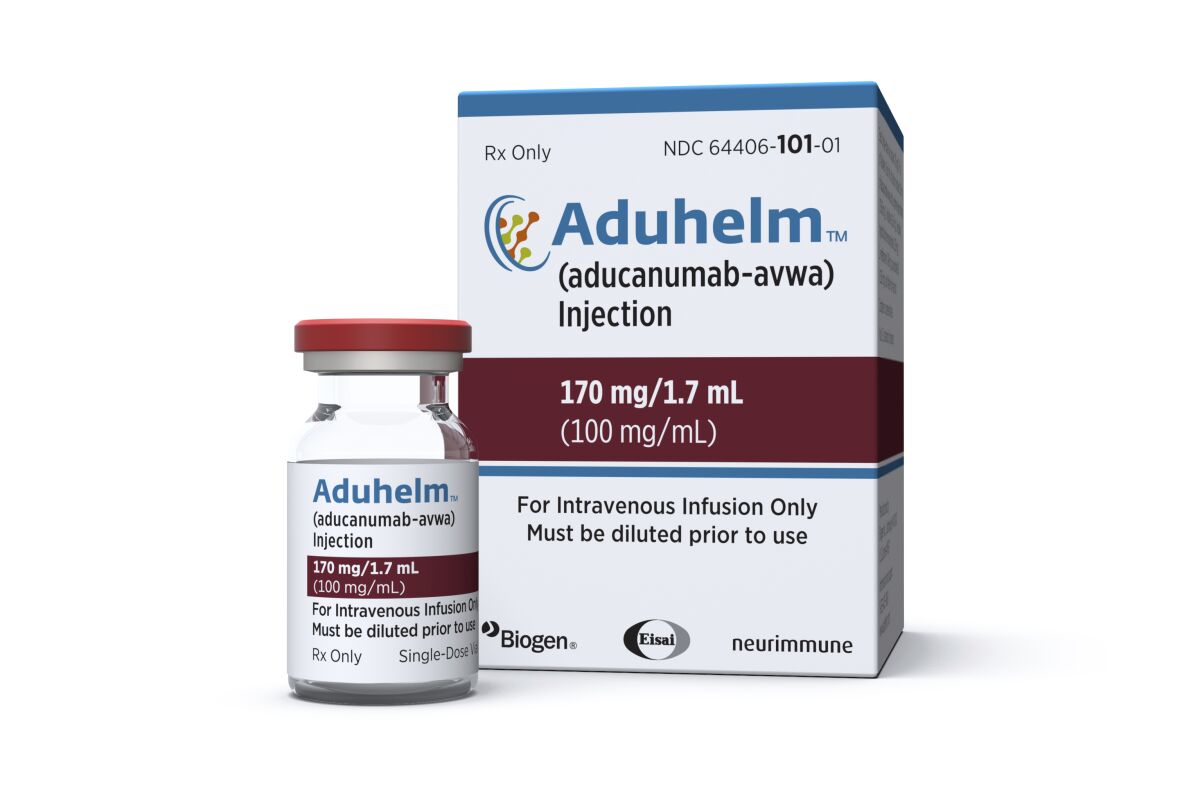 FILE - This image provided by Biogen on Monday, June 7, 2021 shows a vial and packaging for the drug Aduhelm. The first new Alzheimer’s treatment in more than 20 years was hailed as a breakthrough when regulators approved it in June 2021, but its rollout has been slowed by questions about its price and how well it works. (Biogen via AP, File)