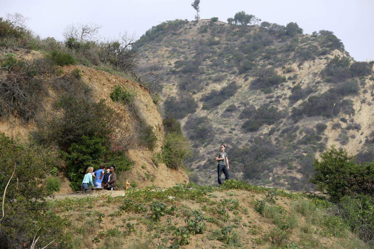People hike Thursday in Runyon Canyon Park, which will be closed for four months starting April 1 to repair a mile-long water main.