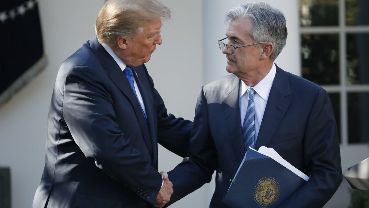 President Trump shakes hands with Jerome H. Powell after announcing him as his nominee to chair the Federal Reserve last year.