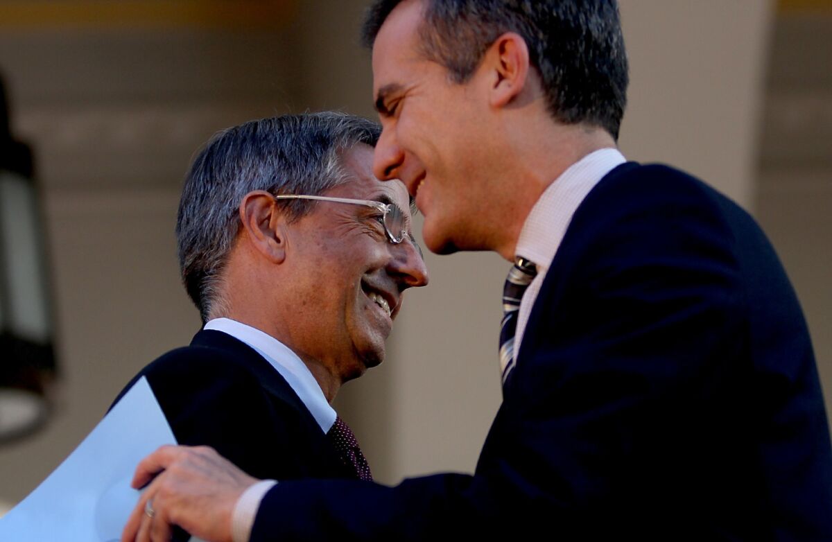 Federal officials said Wednesday that more than 35,000 people in California signed up for health insurance. Above, Los Angeles Mayor Eric Garcetti congratulates Covered California executive Peter Lee during the launch of the Affordable Care Act marketplace Oct. 1