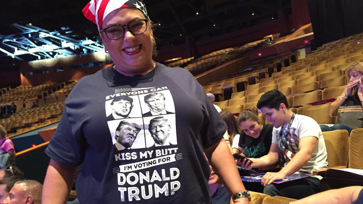 Miami real estate broker Rosario Rodriguez-Ruiz awaits Donald Trump at the Republican presidential candidate's Sept. 16 rally in downtown Miami.