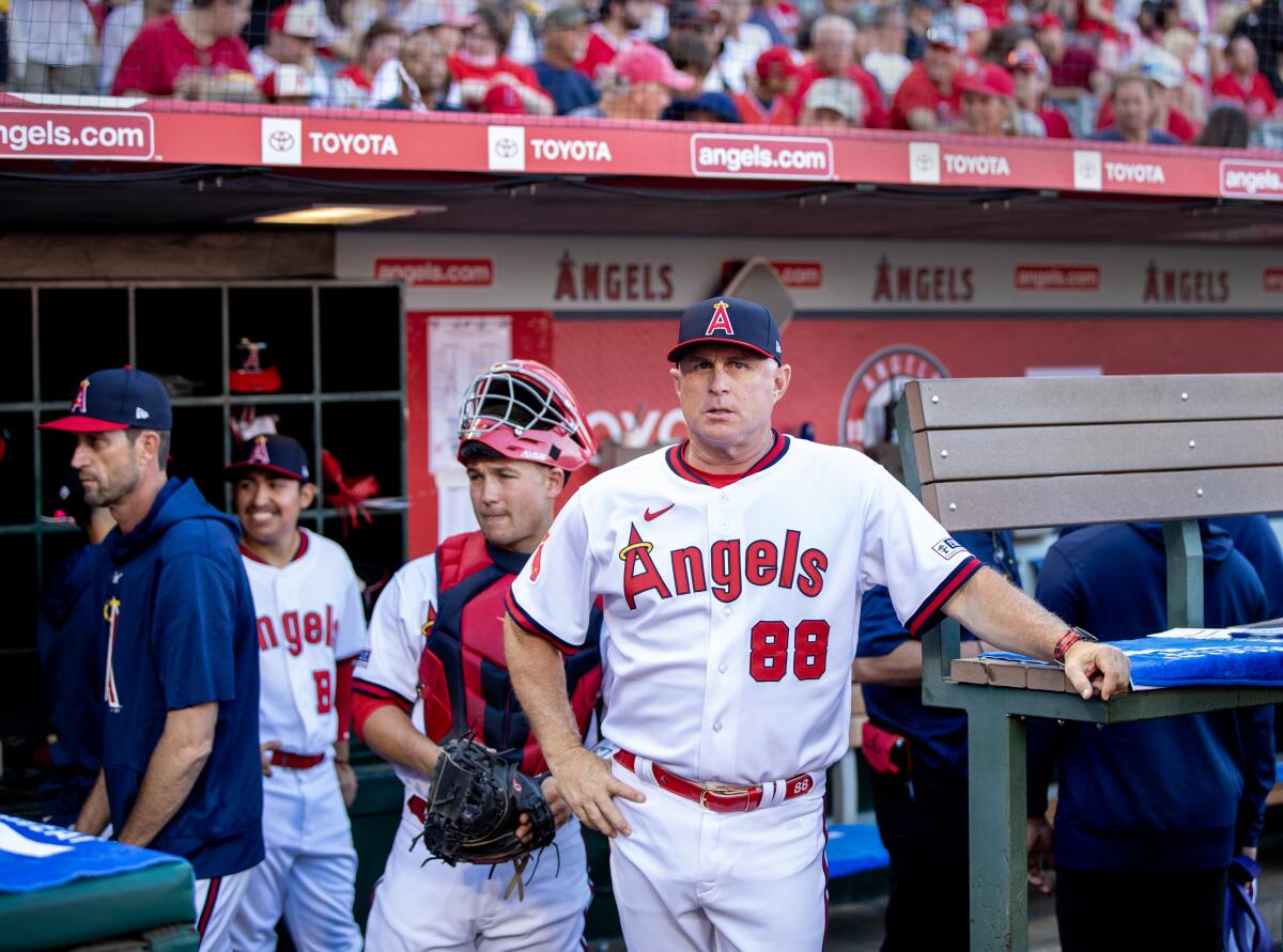Angels manager Phil Nevin waits for the game against the Pirates to start on July 21.