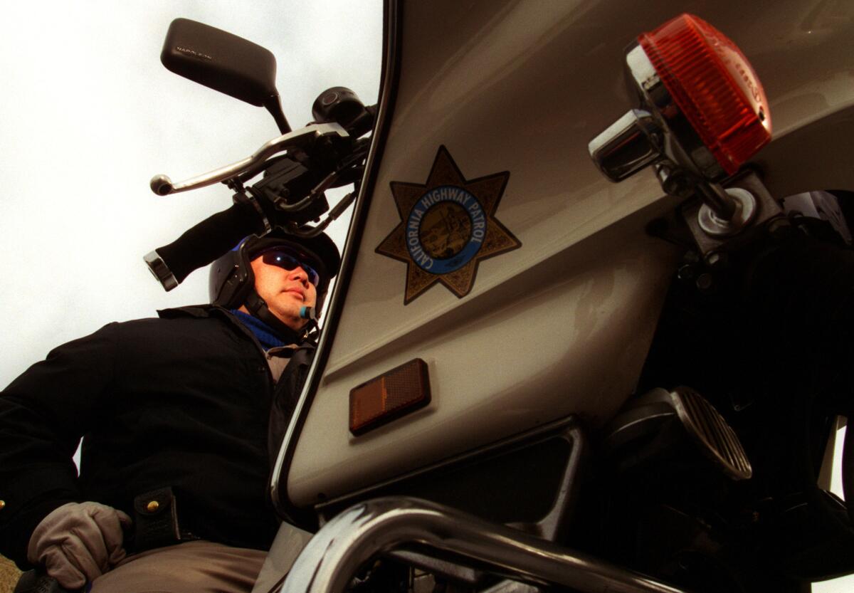 California Highway Patrol Officer Alvin Yamaguchi patrols the highways in Santa Ana.