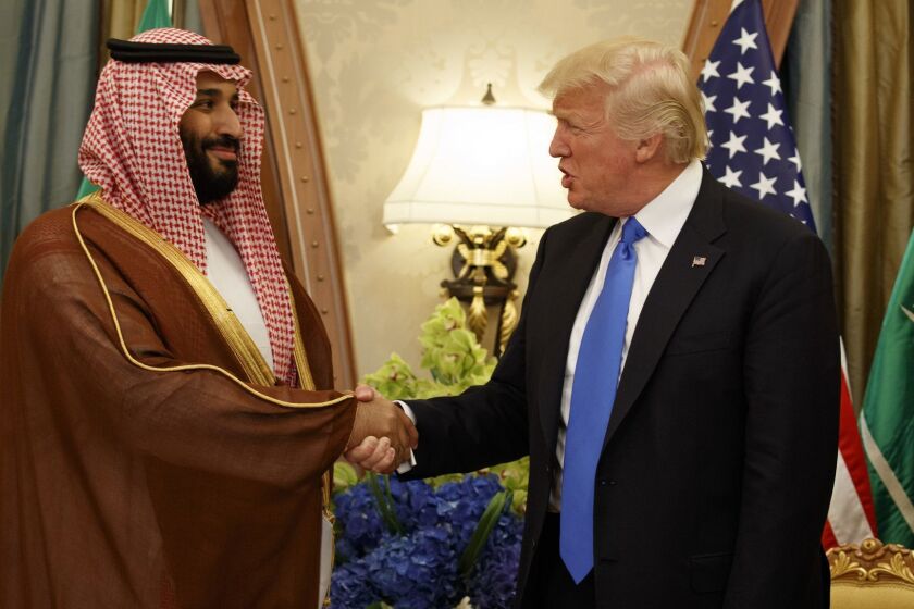 FILE- In this Saturday, May 20, 2017 file photo, President Donald Trump shakes hands with Saudi Deputy Crown Prince and Defense Minister Mohammed bin Salman during a bilateral meeting, in Riyadh. Trump's son-in-law Jared Kushner and Saudi Arabia's newest heir to the throne Mohammed bin Salman, or MBS as he is known, have skyrocketed to power and been entrusted with a wealth of responsibilities and wide-ranging duties, even though neither had the experience or that comes with years of government service. (AP Photo/Evan Vucci, File)