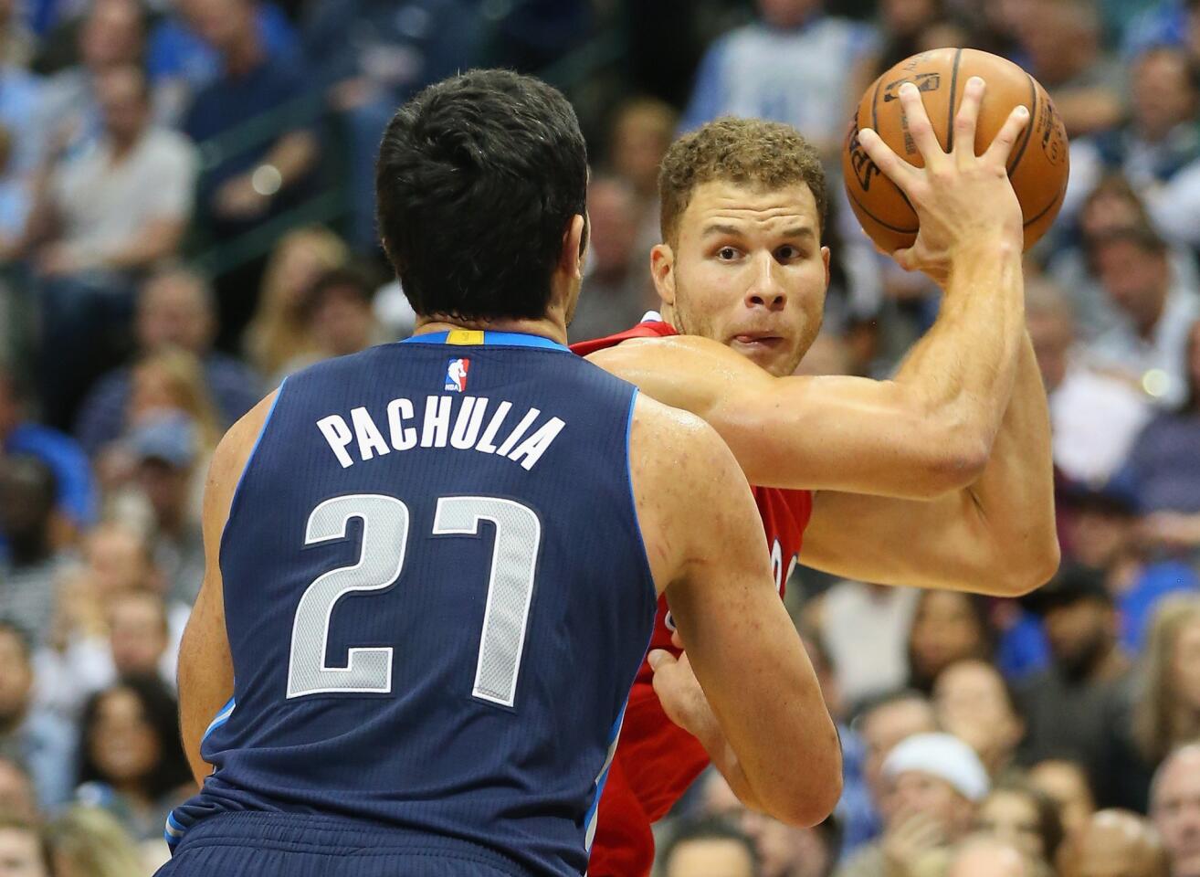 Clippers forward Blake Griffin protects the ball from Mavericks center Zaza Pachulia in the second half.