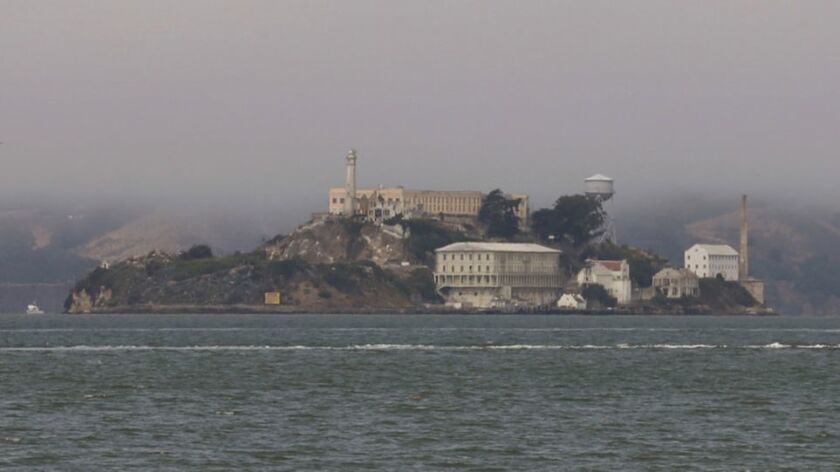 An Alcatraz ex-con, two former correctional officers and about 20 past residents of the island compound gathered on Aug. 12, 2018 for their last official government-sponsored reunion on Alcatraz Island. This Aug. 8 photo shows the hazy air created by California wildfires.