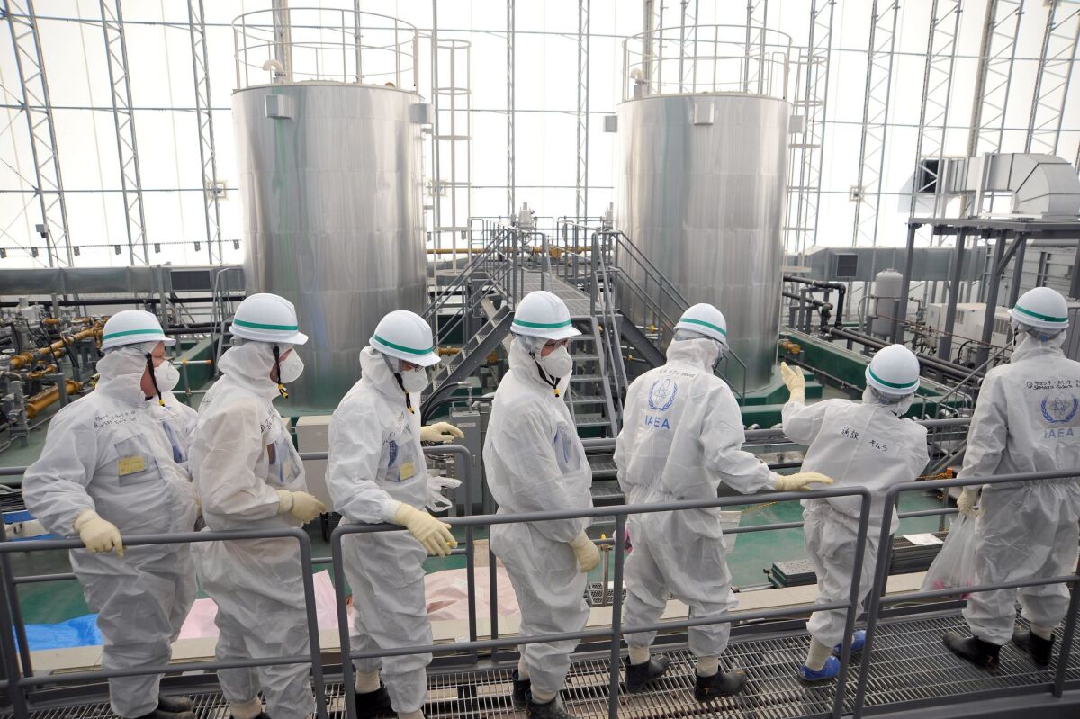 An International Atomic Energy Agency team inspects the Fukushima Dai-ichi nuclear power plant Feb. 17 in an official photo.