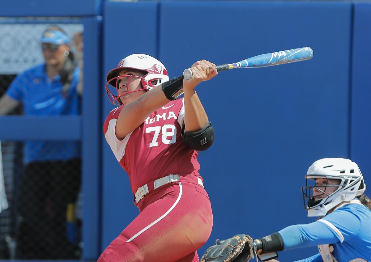 Oklahoma's Jocelyn Alo (78) hits a grand slam during fifth inning of an NCAA softball Women's College World Series elimination game against UCLA on Monday, June 6, 2022, in Oklahoma City. (AP Photo/Alonzo Adams)