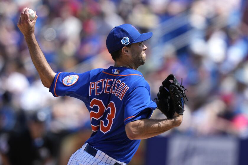 New York Mets starting pitcher David Peterson (23) throws during the third inning of a spring training baseball game against the Washington Nationals, Tuesday, March 14, 2023, in Port St. Lucie, Fla. (AP Photo/Lynne Sladky)