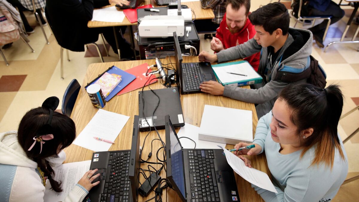 Students at Francis Polytechnic High School in Los Angeles take a computer programming class.
