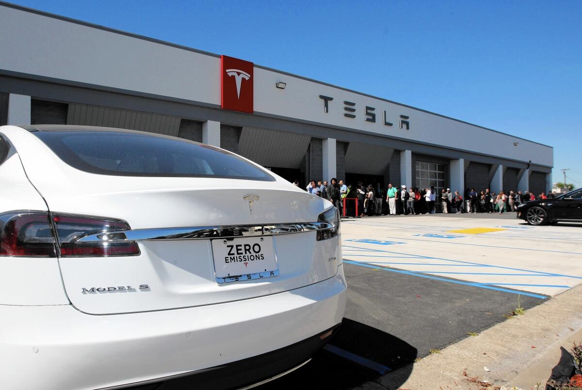 Hundreds of people were lined up before 10 a.m. at Tesla Motors in Burbank to put a deposit of $1,000 for the upcoming Model 3 electric vehicle, which is not expected to be released until the end of 2017.