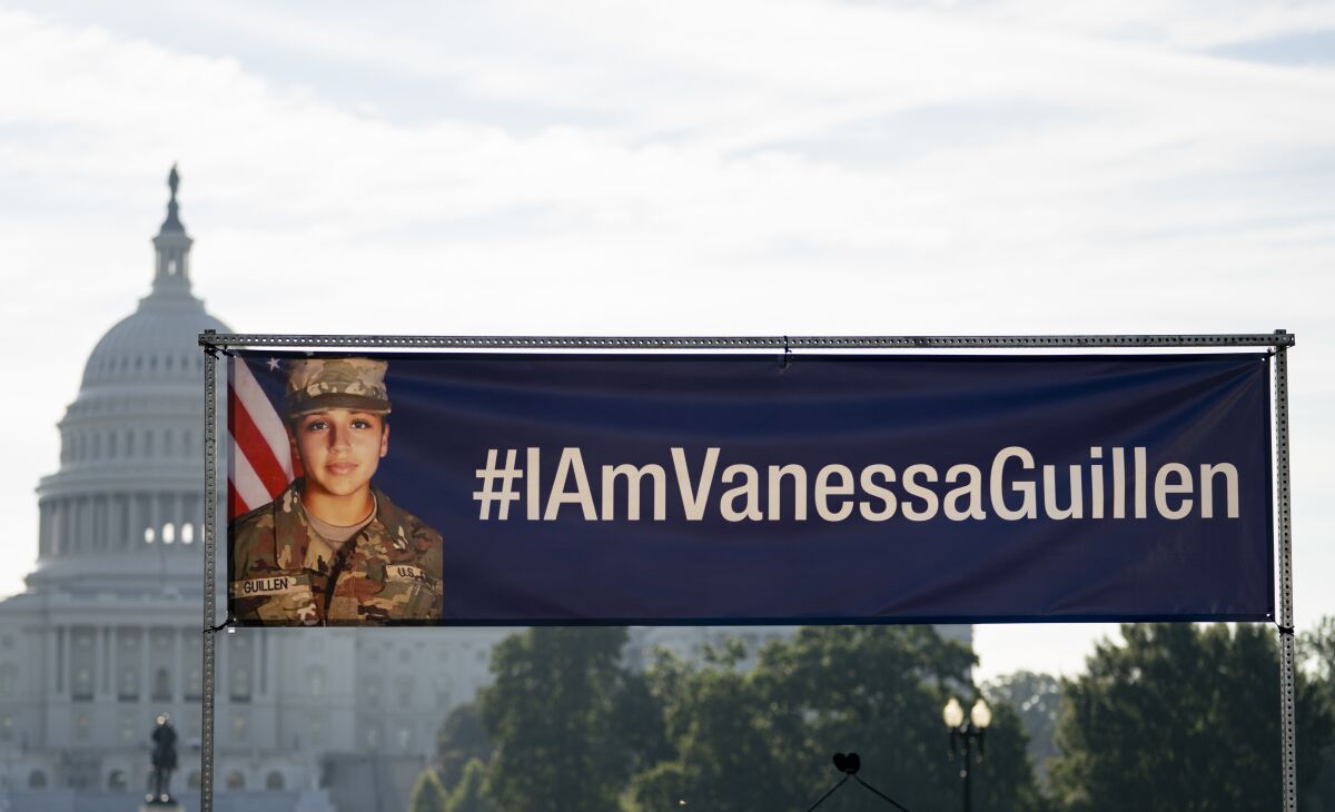 An image of slain Army Spc. Vanessa Guillen and #IAmVanessaGuillen is seen before the start of a news conference on the National Mall in front of Capitol Hill, Thursday, July 30, 2020, in Washington. (AP Photo/Carolyn Kaster)