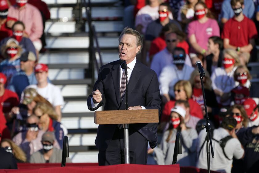 Sen. David Perdue, R-Ga., speaks during a campaign rally for President Donald Trump at Middle Georgia Regional Airport, Friday, Oct. 16, 2020, in Macon, Ga. (AP Photo/John Bazemore)
