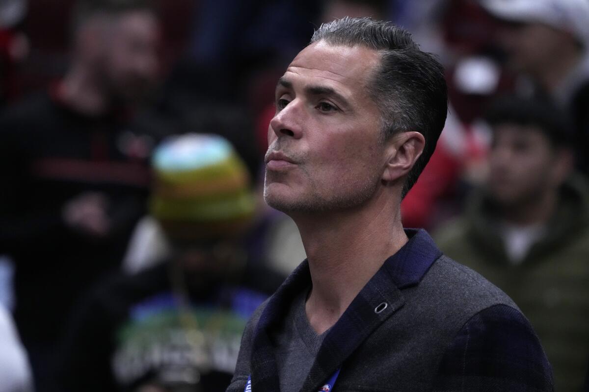 Lakers general manager Rob Pelinka watches players warm up before a game against the Chicago Bulls in March.
