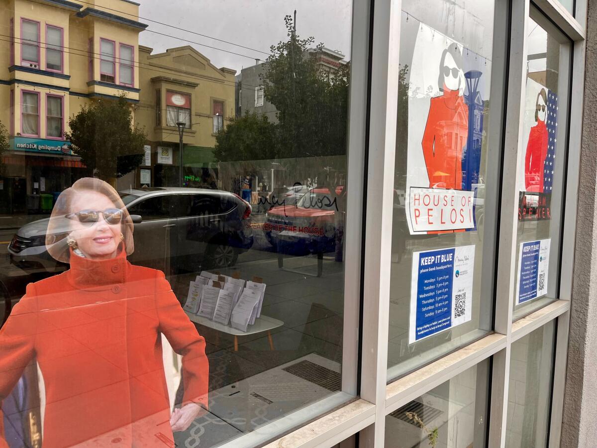 A cutout of a woman stands behind a window storefront.