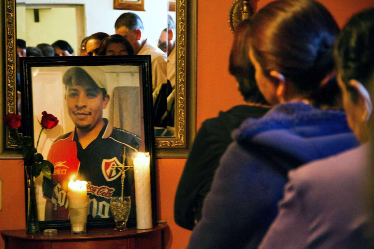 Relatives and friends of Ruben Garcia Villalpando, a immigrant who was killed by police in Texas, take part in a Mass at his sister's house in Nuevo Porvenir, Mexico, on Feb. 28.