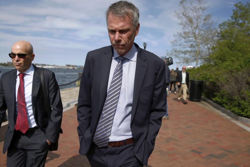 FILE - In this May 22, 2019 file photo, Peter Jan Sartorio leaves federal court in Boston after pleading guilty to charges in a nationwide college admissions bribery scandal. Sartorio was sentenced on Friday to one year of probation.