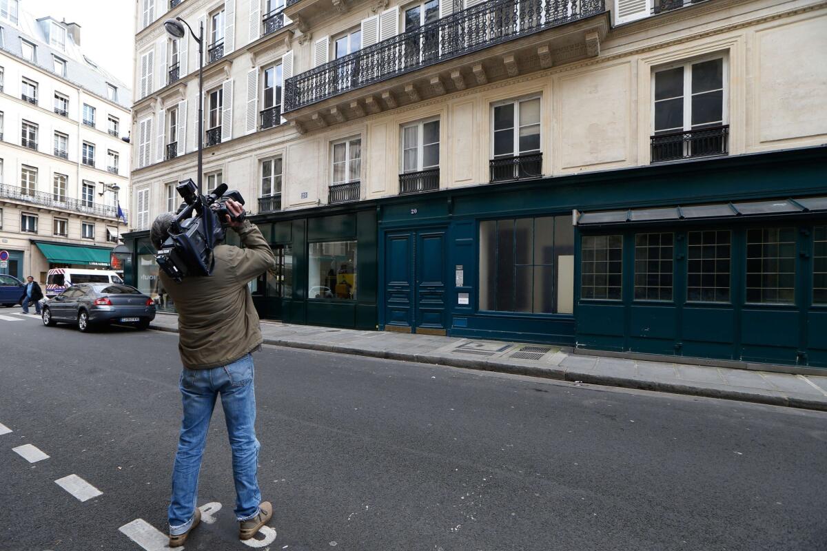 A photographer on Monday shoots video of the building where French President Francois Hollande allegedly met with French actress Julie Gayet, located at 20 Rue du Cirque, near the Elysee Palace in Paris.