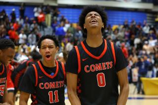 Tajh Ariza (right) and Malachi Harris of Westchester celebrate after winning the City Section Open Division title.
