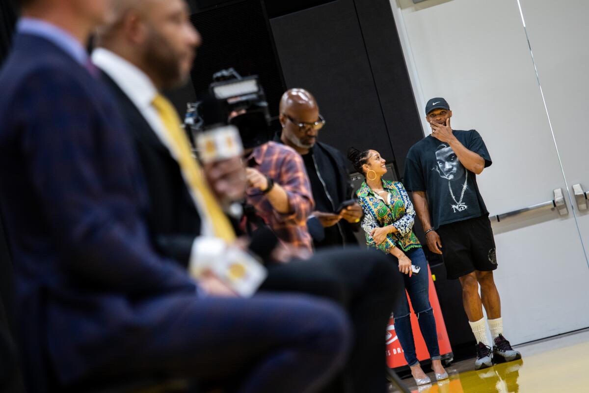 Russell Westbrook, right, listens to new Lakers coach Darvin Ham during his introductory news conference Monday.