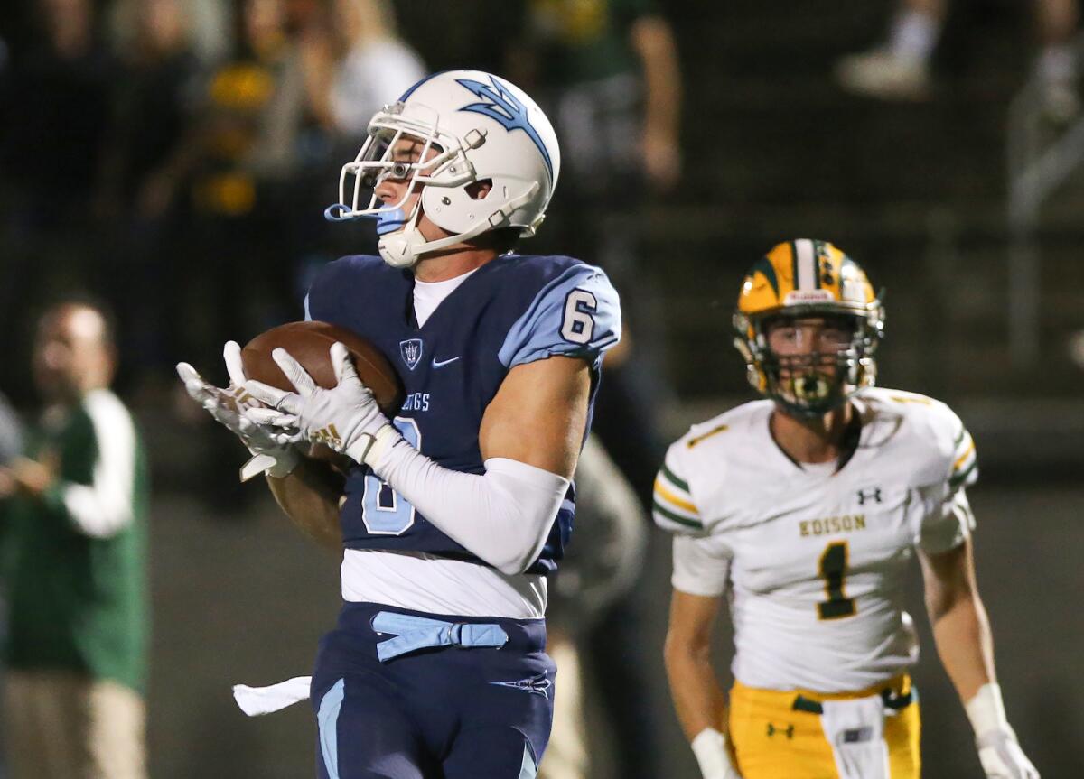 Corona del Mar receiver John Humphreys hauls in a touchdown pass during a Sunset League game earlier this season.