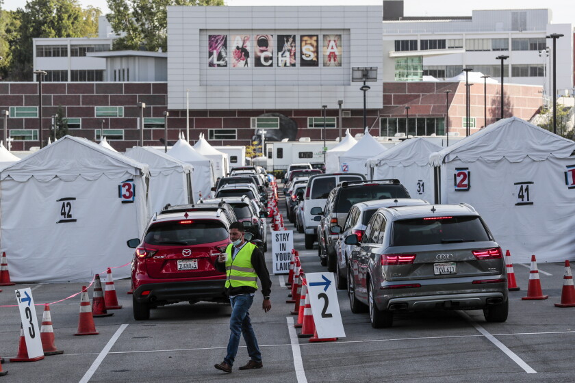 South African and Brazilian coronavirus variants land in
L.A. 3 Los Angeles CA, Monday, April 5, 2021 - Drivers line up for Covid-19 vaccines at Cal State LA the day it is announced that 4 million shots have been provided to under served communities. (Robert Gauthier/Los Angeles Times)