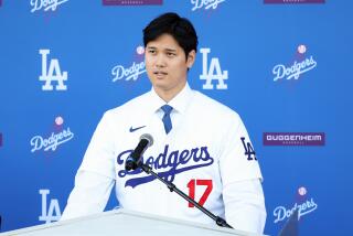 LOS ANGELES, CA - DECEMBER 14: Shohei Ohtani speaks as the Los Angeles Dodgers introduce Ohtani.