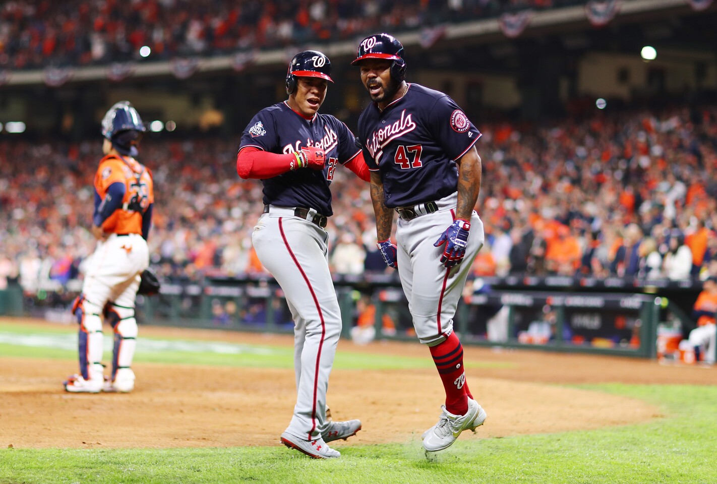 HOUSTON, TEXAS - OCTOBER 30: Howie Kendrick #47 of the Washington Nationals is congratulated by his teammate Juan Soto #22 after hitting a two-run home run against the Houston Astros during the seventh inning in Game Seven of the 2019 World Series at Minute Maid Park on October 30, 2019 in Houston, Texas. (Photo by Mike Ehrmann/Getty Images)