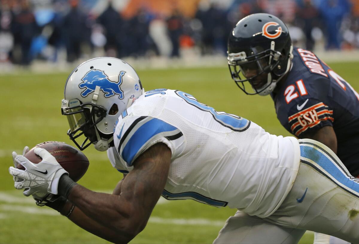 Detroit receiver Calvin Johnson makes a touchdown reception against Chicago safety Ryan Mundy on Sunday.