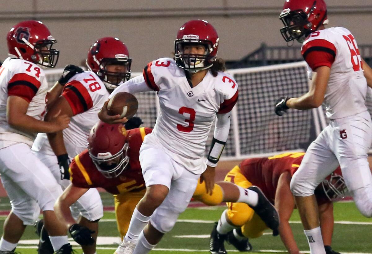 Glendale High's quarterback Juan Estrada (3) runs with the ball in the first quarter of the La Canada High School boys football team against Glendale High School Boys football team in a nonleague game at La Canada High School in La Canada Flintridge, Ca., Saturday, August 31, 2019. (photo by James Carbone)
