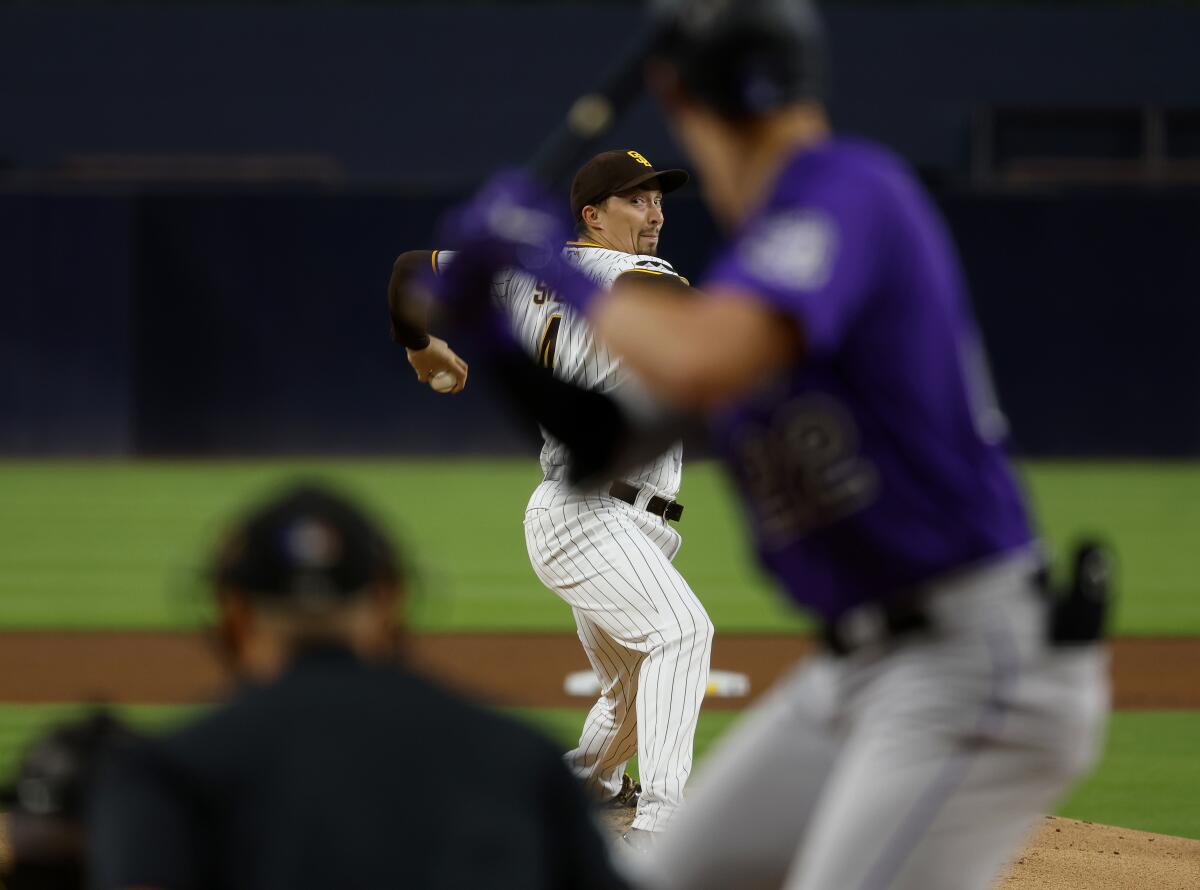 Padres pitcher Blake Snell throws against Colorado Rockies' Nolan Jones at Petco Park on Tuesday.