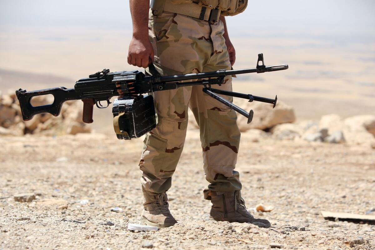 An Kurdish fighter on the front line in Bashiqa, near the northern Iraqi city of Mosul on Tuesday.