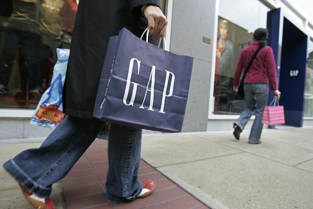 A customer leaves a Gap store in Palo Alto on Feb. 8, 2007.