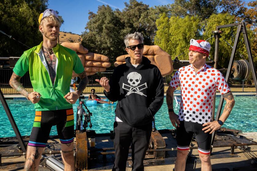 Machine Gun Kelly, left, Johnny Knoxville, and Steve-O in “Jackass Forever”