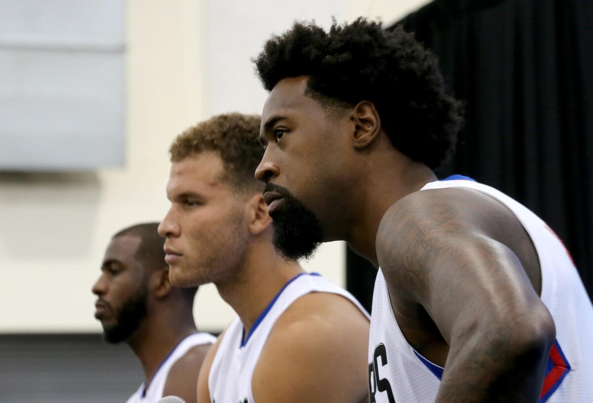 Clippers starters (from left) Chris Paul, Blake Griffin and DeAndre Jordan meet with reporters during media day at the team's training facility in Playa Vista on Friday.