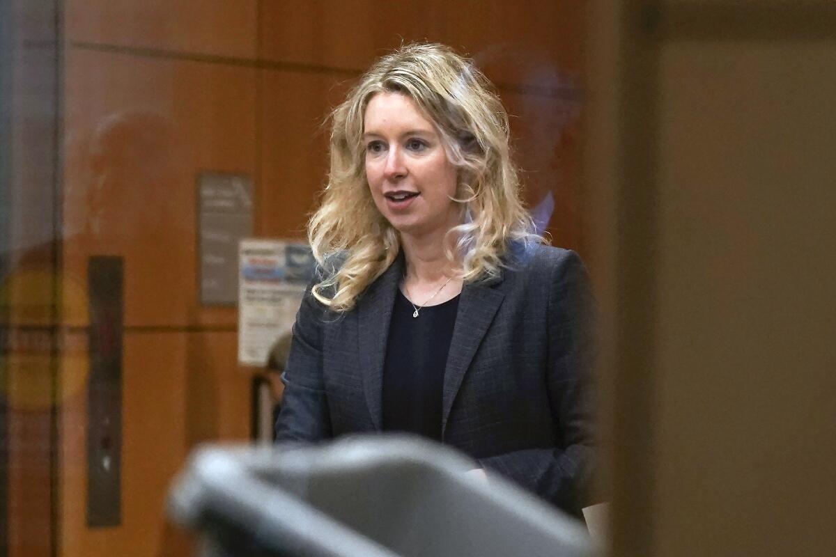 Former Theranos CEO Elizabeth Holmes arrives at federal court in San Jose, Calif. 