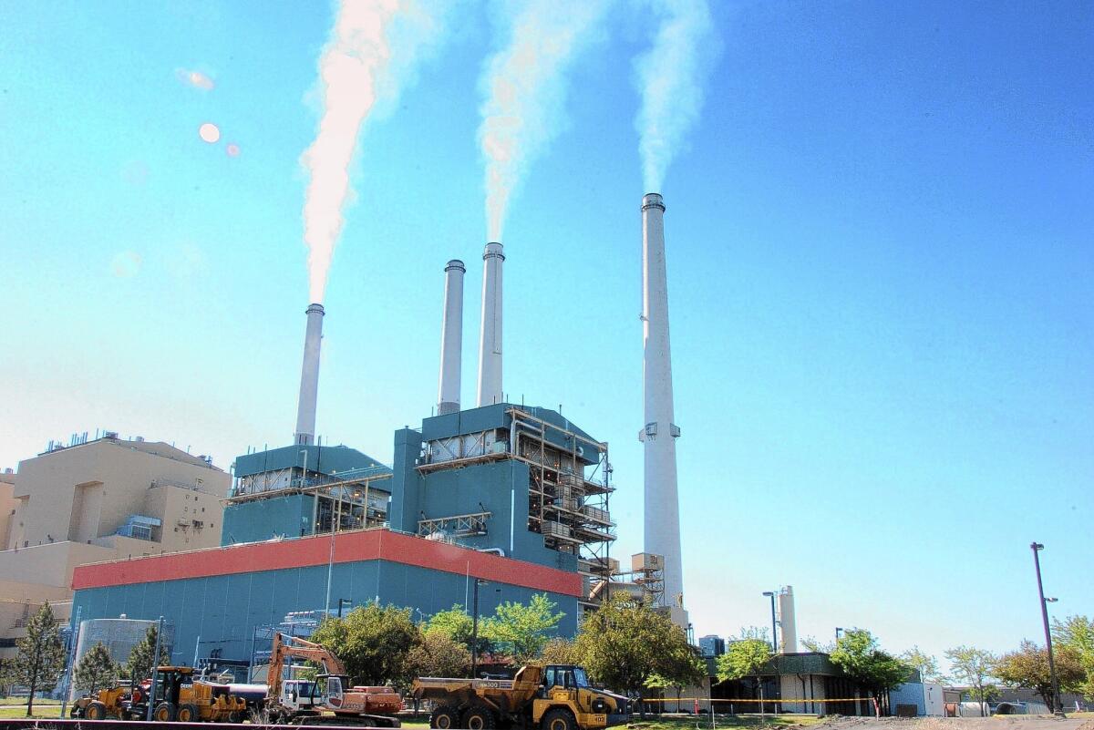 Some environmental watchdogs contend the administration's system of leasing federal lands for coal mining undercuts its efforts to reduce greenhouse gas emissions. Above, the Colstrip Steam Electric Station, a coal burning power plant in in Colstrip, Mont.