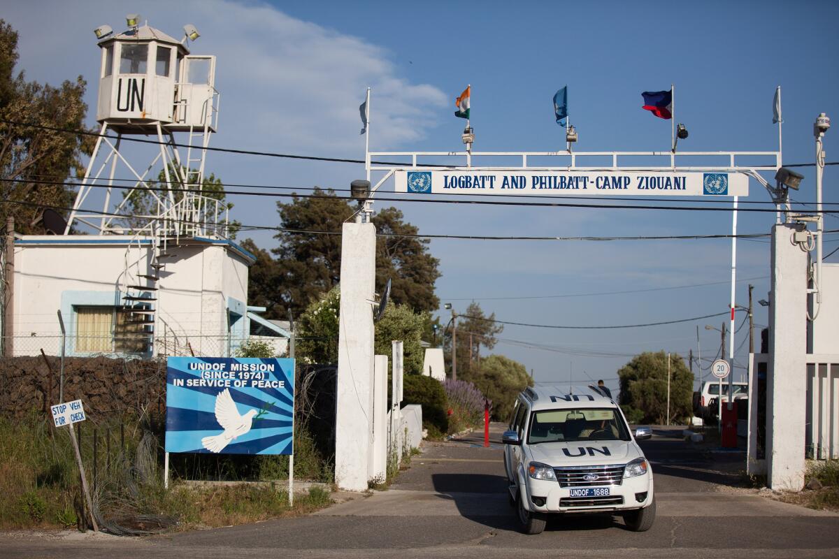 A United Nations Disengagement Observer Force vehicle drives out of the UNDOF camp on the Israeli side of the border between the Israeli-occupied Golan Heights and Syria.