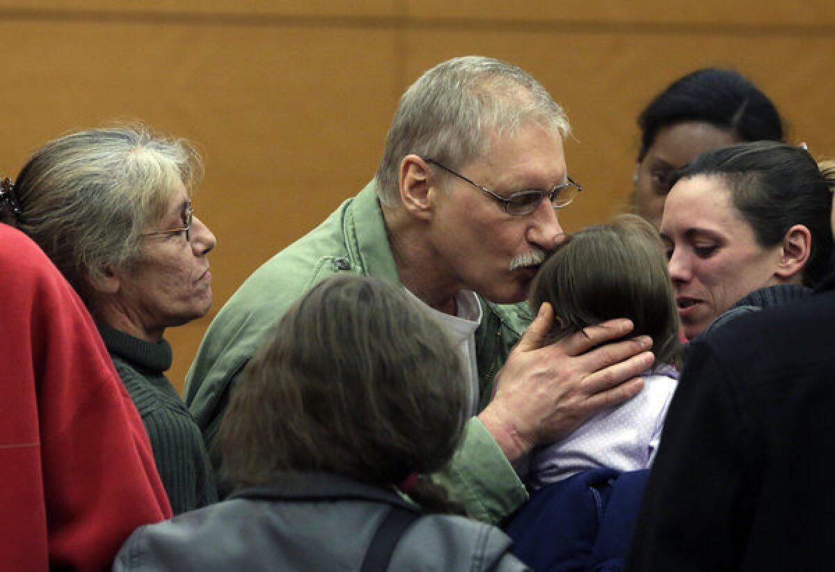 David Ranta kisses a family member after being freed in state Supreme Court in Brooklyn, New York. He spent more than two decades behind bars before a reinvestigation cast serious doubt on evidence used to convict him in the 1990 shooting of Rabbi Chaskel Werzberger.
