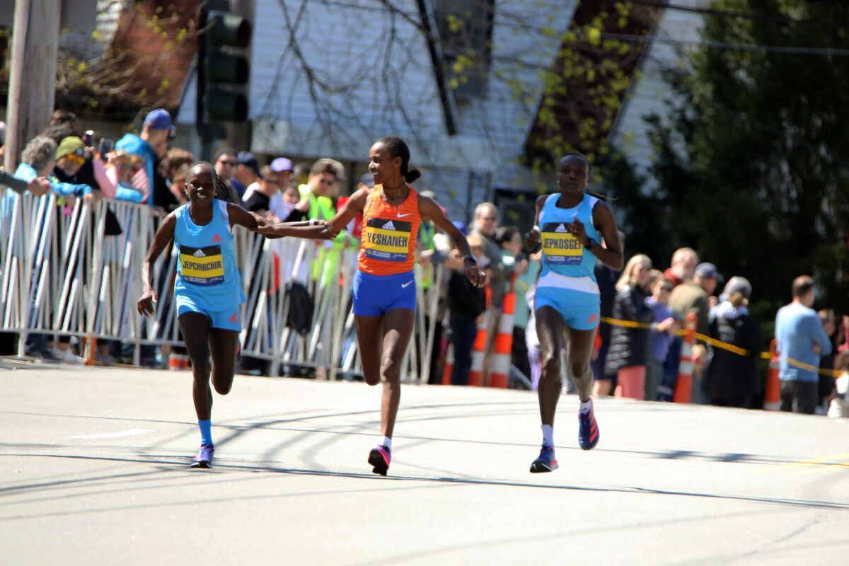 The elite men break from the starting line of the 126th Boston Marathon