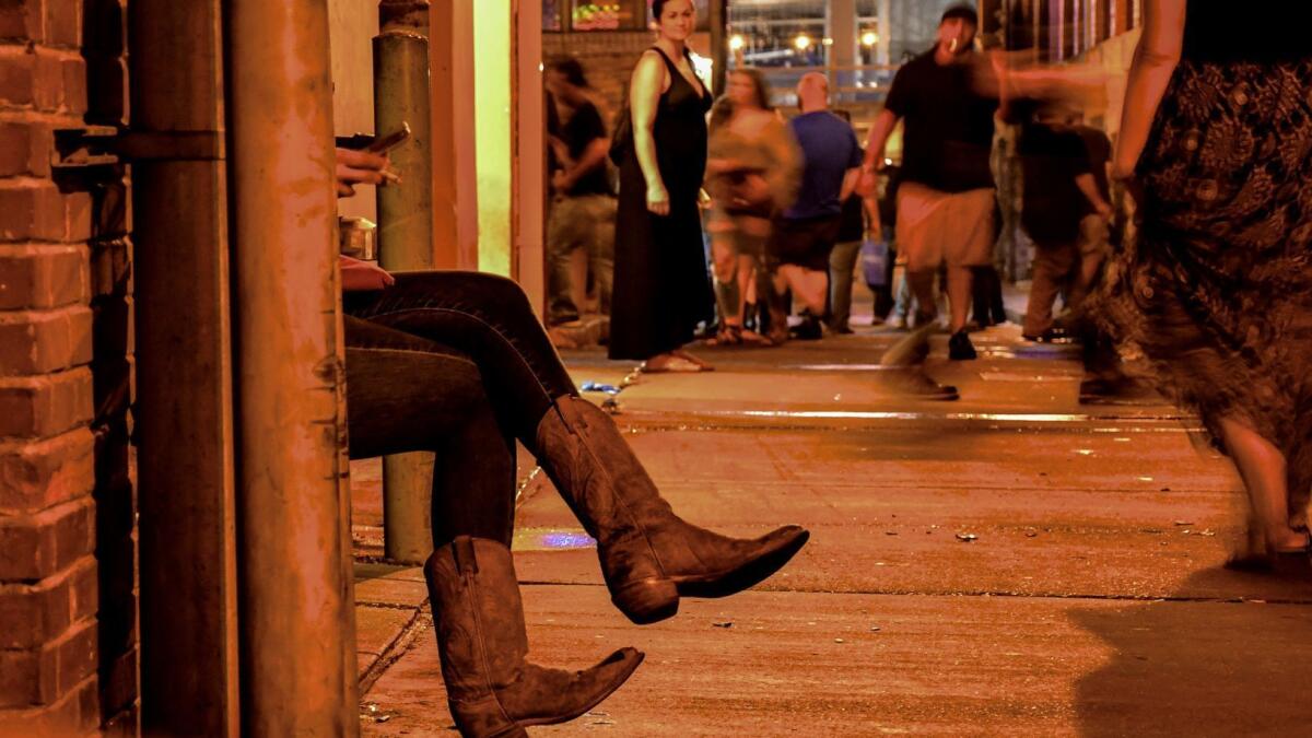 Saturday night crowds fill the stress of Nashville's rowdy LoBro district, along Lower Broadway.